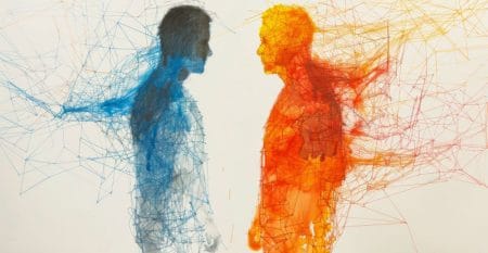 Two people are standing next to each other, one is blue and the other is red