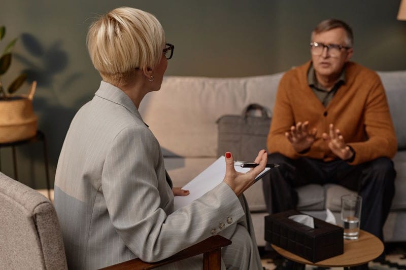 female-psychologist-listening-man-therapy
